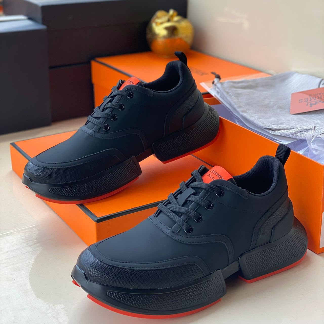 Hermès Chunky Sneakers – Black & Orange